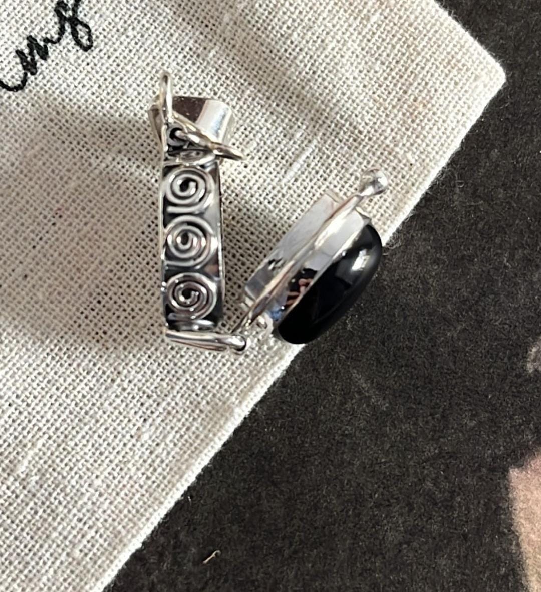 Sleek Silver Pendant with Black Onyx Oval Storage