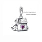 Close-up of dog house silver pendant with polished finish