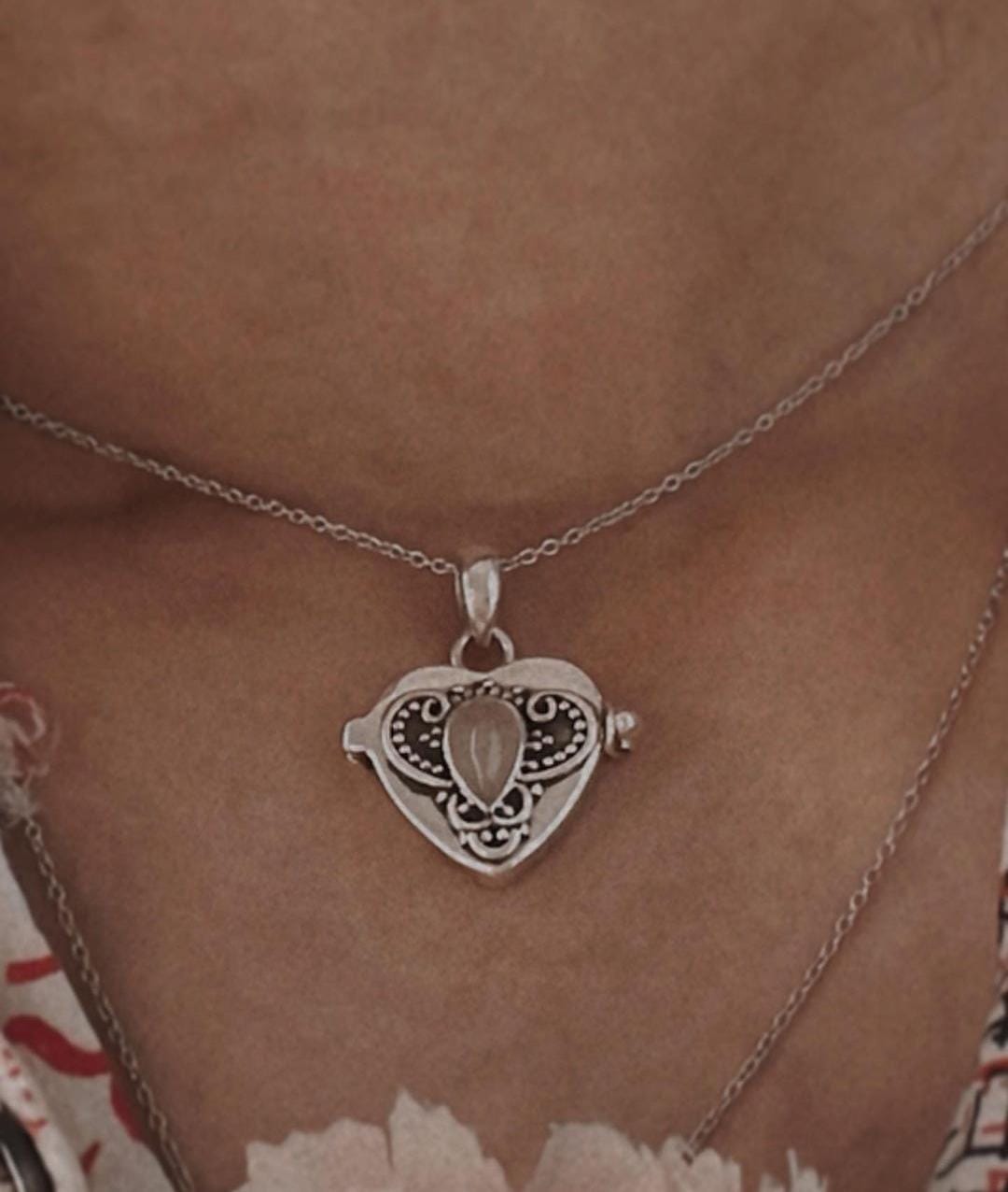 Elegant Silver Pendant with Moonstone and Heart Storage