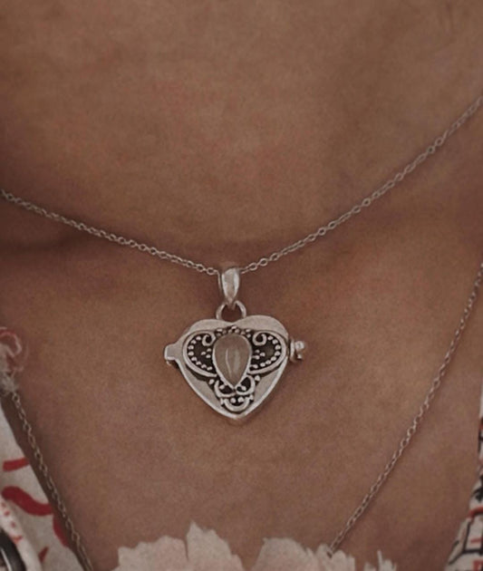 Elegant Silver Pendant with Moonstone and Heart Storage