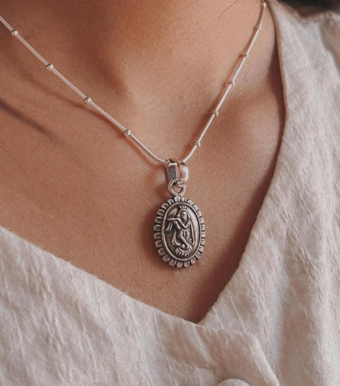 Krishna Oval Silver Pendant with Floral Design