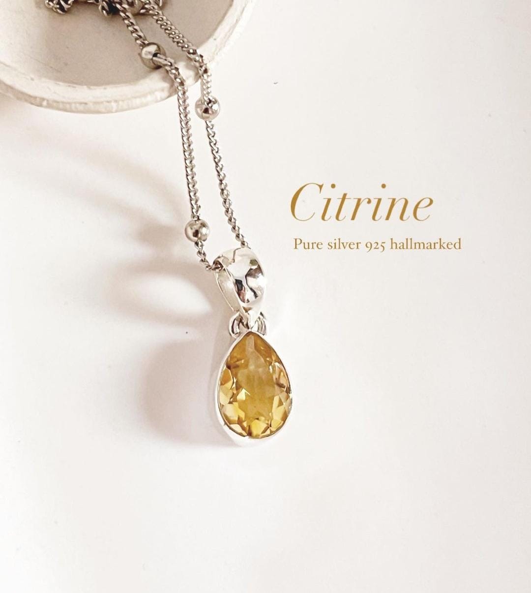 Citrine pear cut silver pendant with elegant design