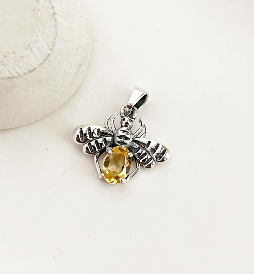 Beautiful silver pendant with a bee design and bright citrine stone.