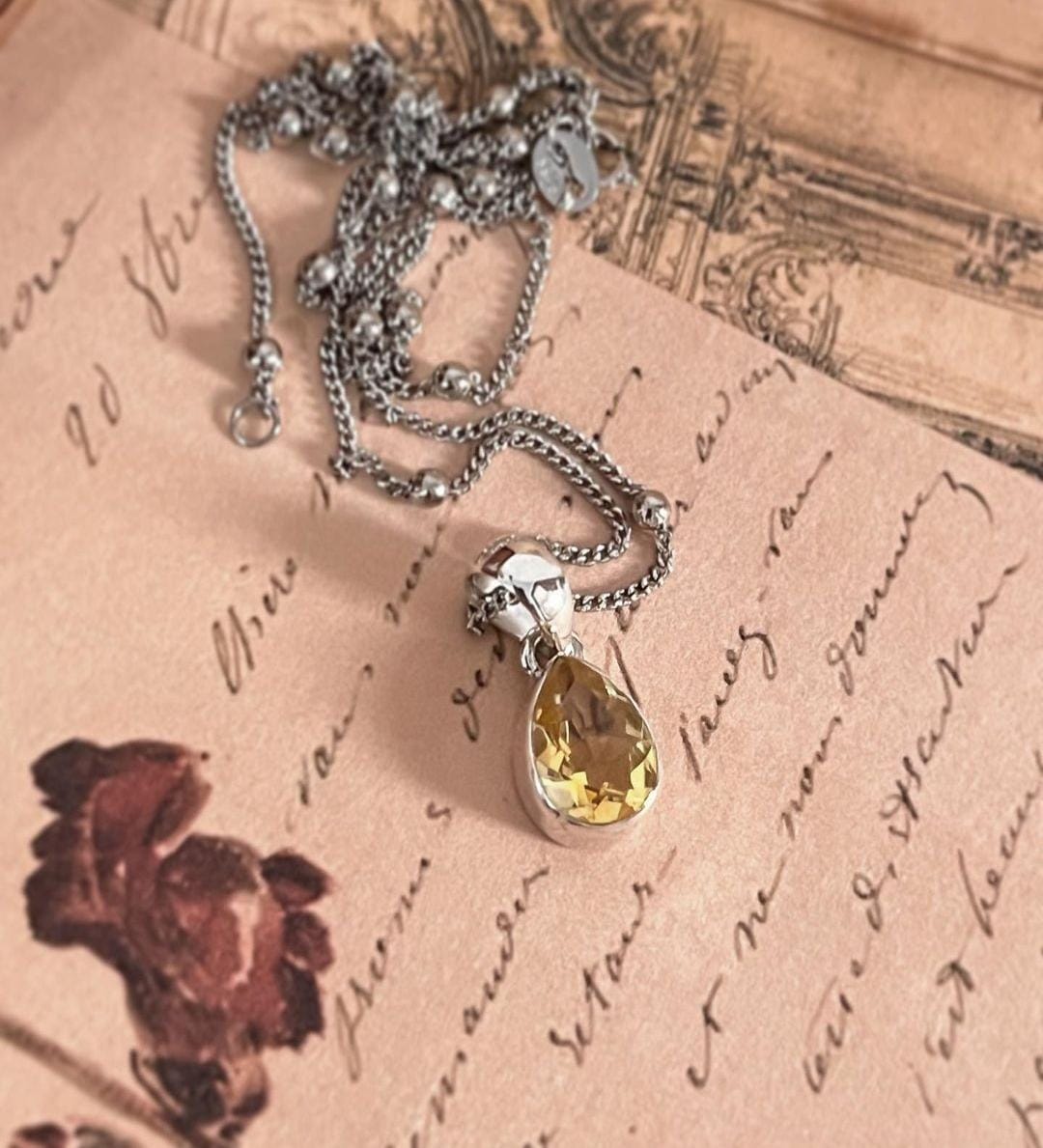 Handcrafted silver pendant with a beautiful pear cut citrine stone