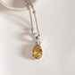 Stylish silver pendant featuring a pear cut citrine gemstone