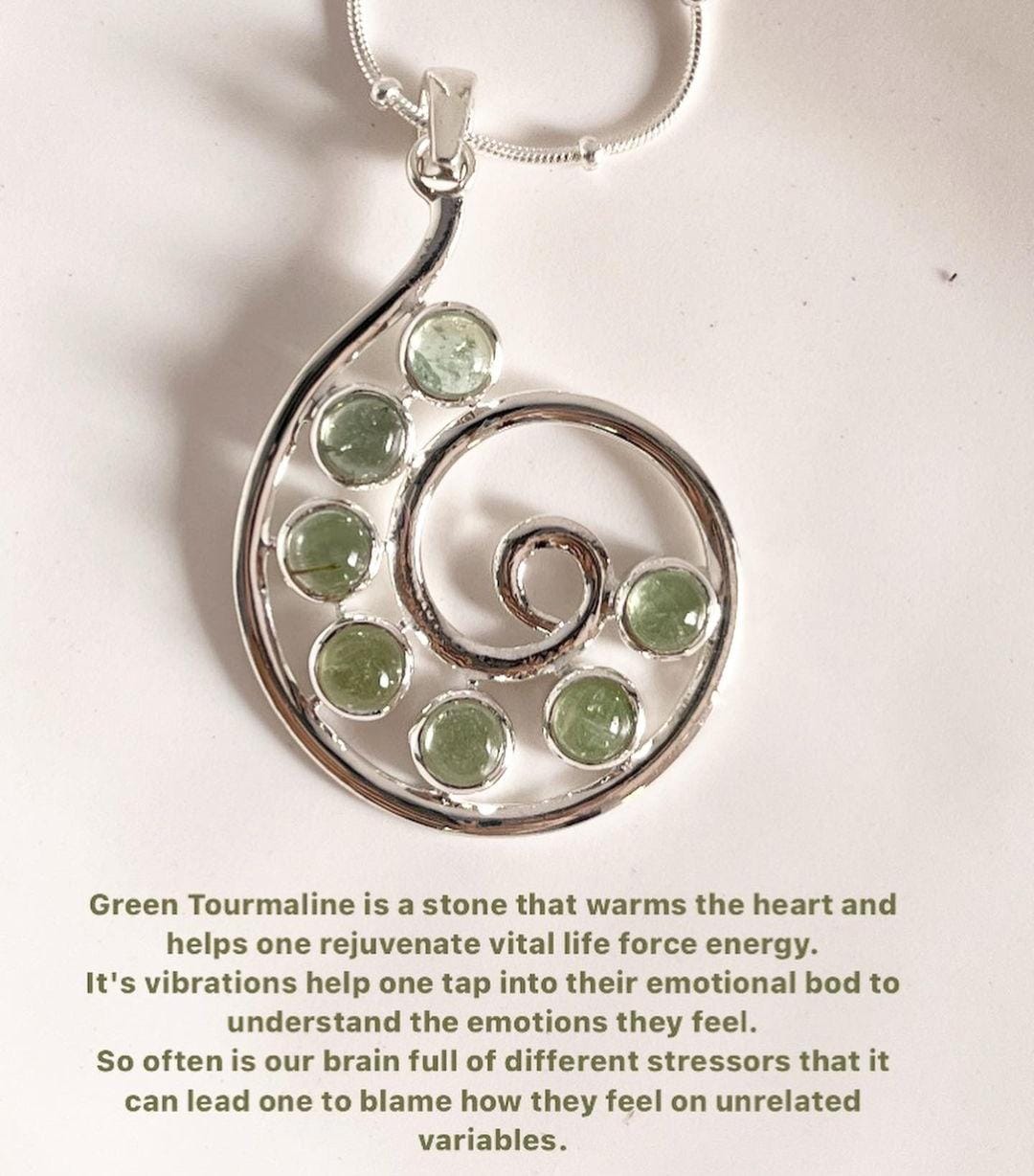 Green tourmaline pendant with a spiral design in sterling silver