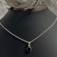 Charming round Iolite pendant in polished silver