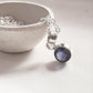 Iolite round pendant in sterling silver for a timeless look