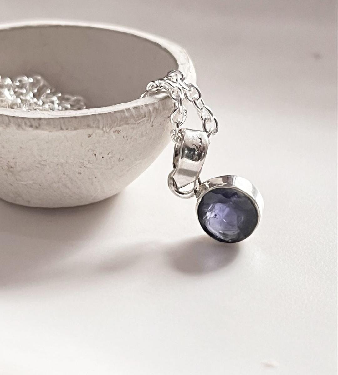 Iolite round pendant in sterling silver for a timeless look