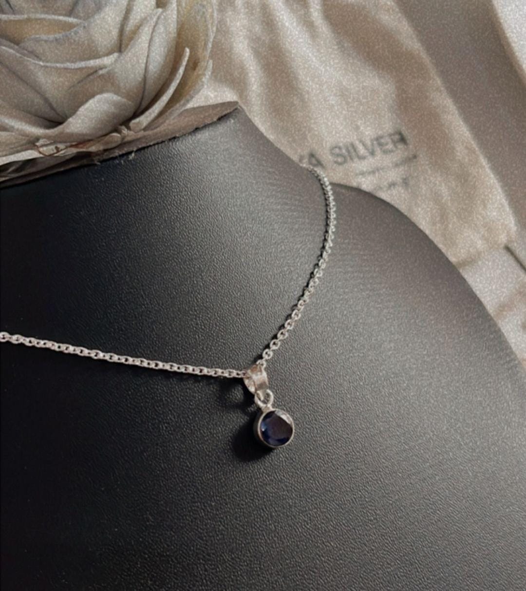 Modern round Iolite pendant in sterling silver design