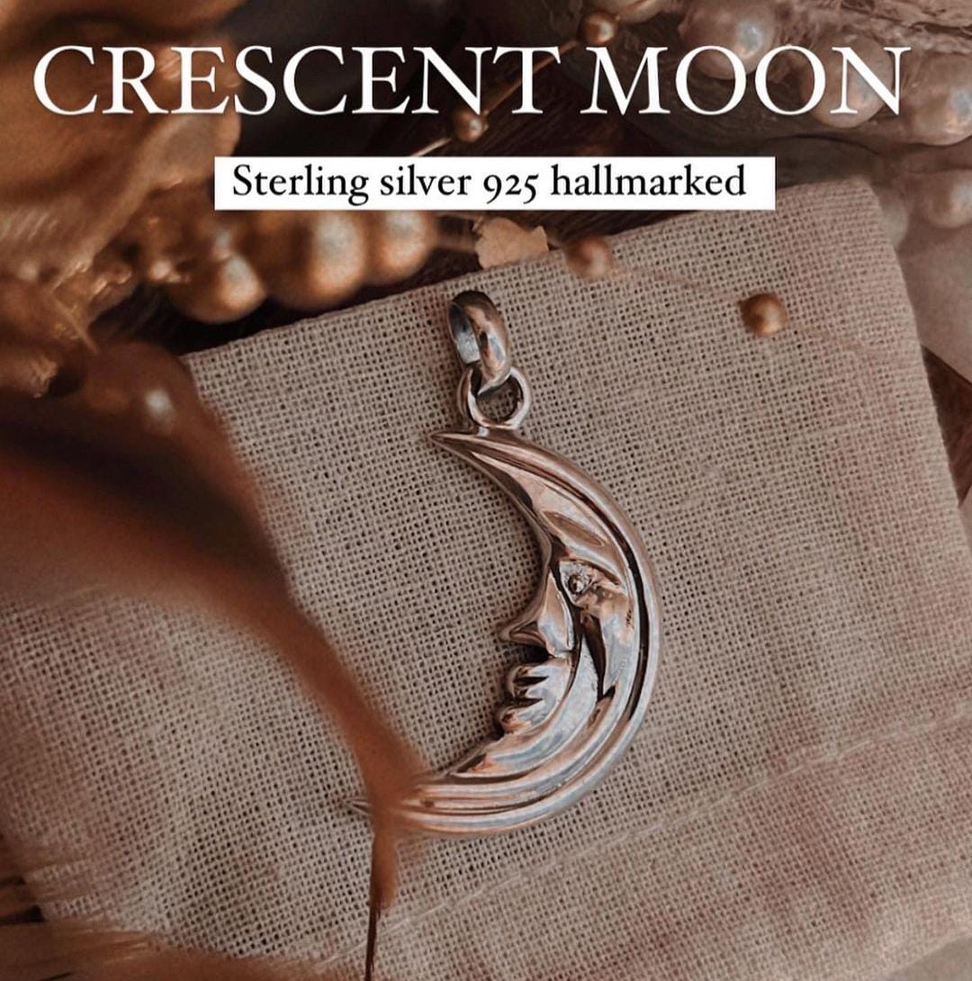 Big crescent moon silver pendant with sleek polished design
