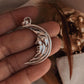 Bold crescent moon shaped silver pendant with polished shine