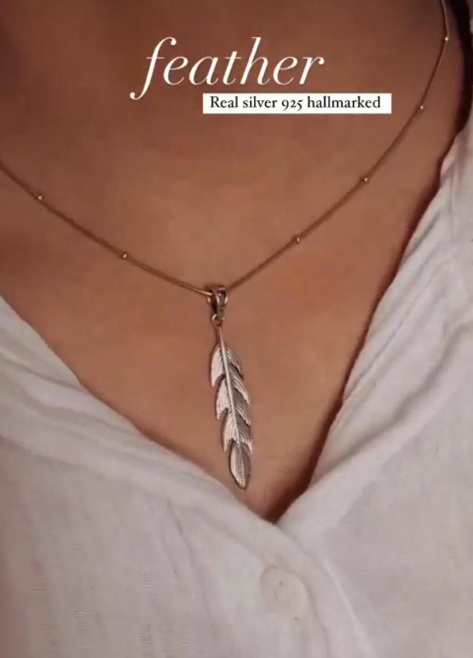 Charming feather silver pendant with intricate design and graceful shape