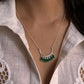 Charming green onyx pendant on a sleek silver necklace