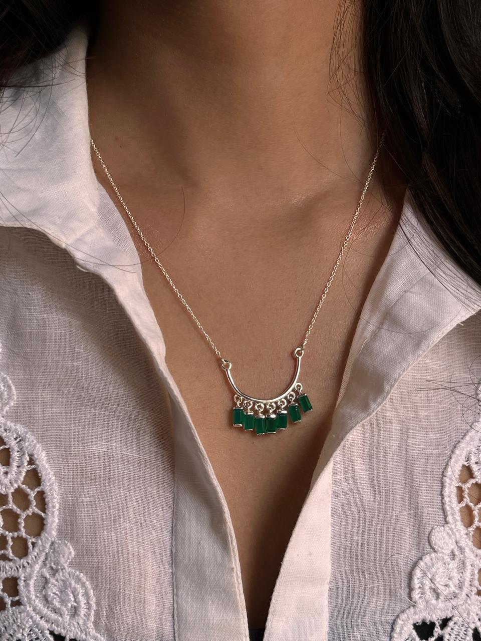 Charming green onyx pendant on a sleek silver necklace