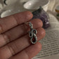Handcrafted silver pendant featuring a serpent motif
