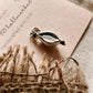 Nature-inspired silver pendant with a genuine cowrie shell charm