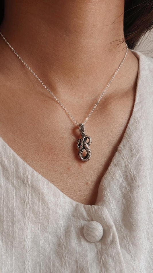 Sterling silver serpent pendant with detailed scales