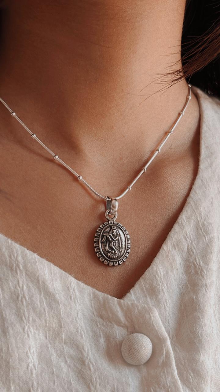 Intricate Krishna Oval Pendant with Flower Motif