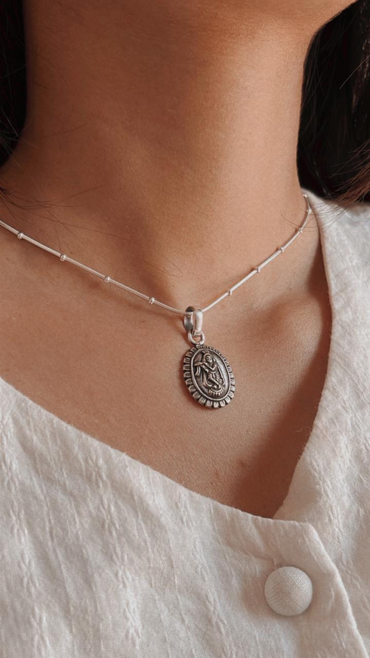 Handcrafted Krishna Oval Flower Pendant in Silver