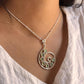 Charming green tourmaline spiral-shaped pendant in silver