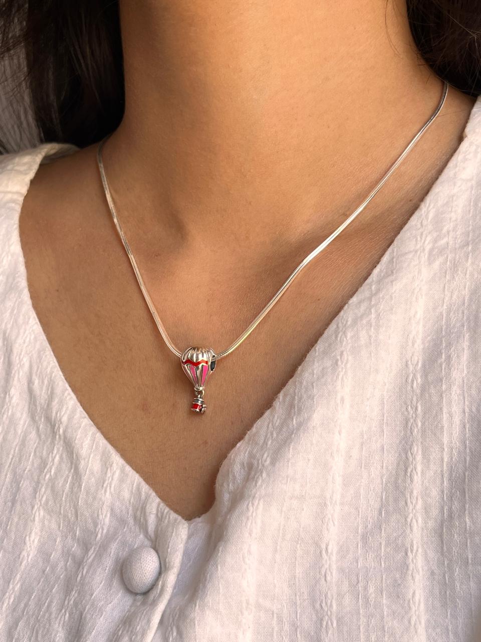 Elegant silver pendant featuring a hot balloon charm