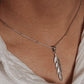 Elegant feather silver pendant with delicate detailing and polished finish