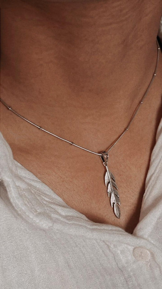 Elegant feather silver pendant with delicate detailing and polished finish