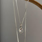 Elegant pear-cut rose quartz pendant with silver setting