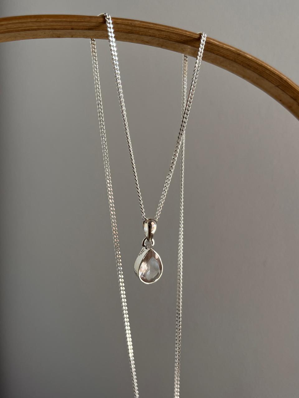 Elegant pear-cut rose quartz pendant with silver setting