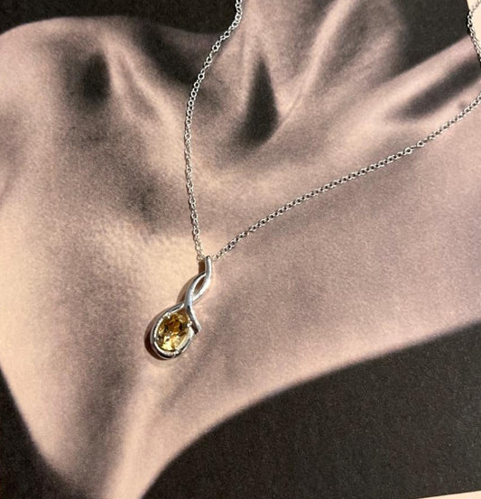 Beautiful citrine cross solitaire silver pendant on a fine chain