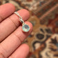 Sleek silver pendant featuring a round aqua chalcedony stone.