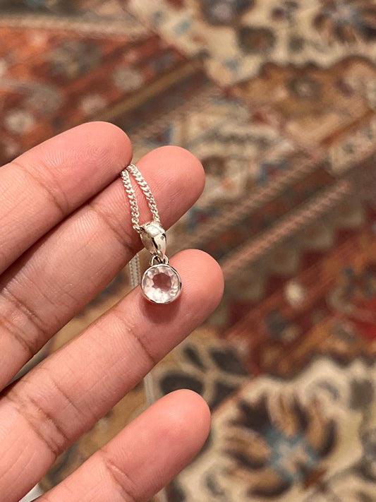 Clear quartz round cut silver pendant with polished design