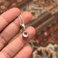 Sleek round cut clear quartz stone set in a silver pendant