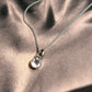 Clear quartz round cut silver pendant with refined, minimalist design