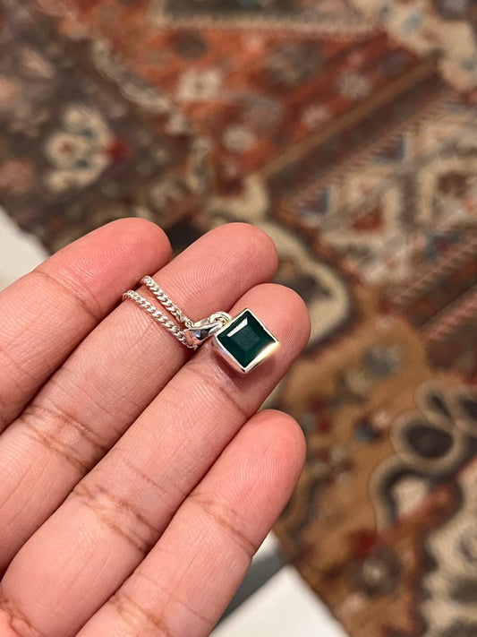 Sterling silver pendant featuring a square cut green onyx stone