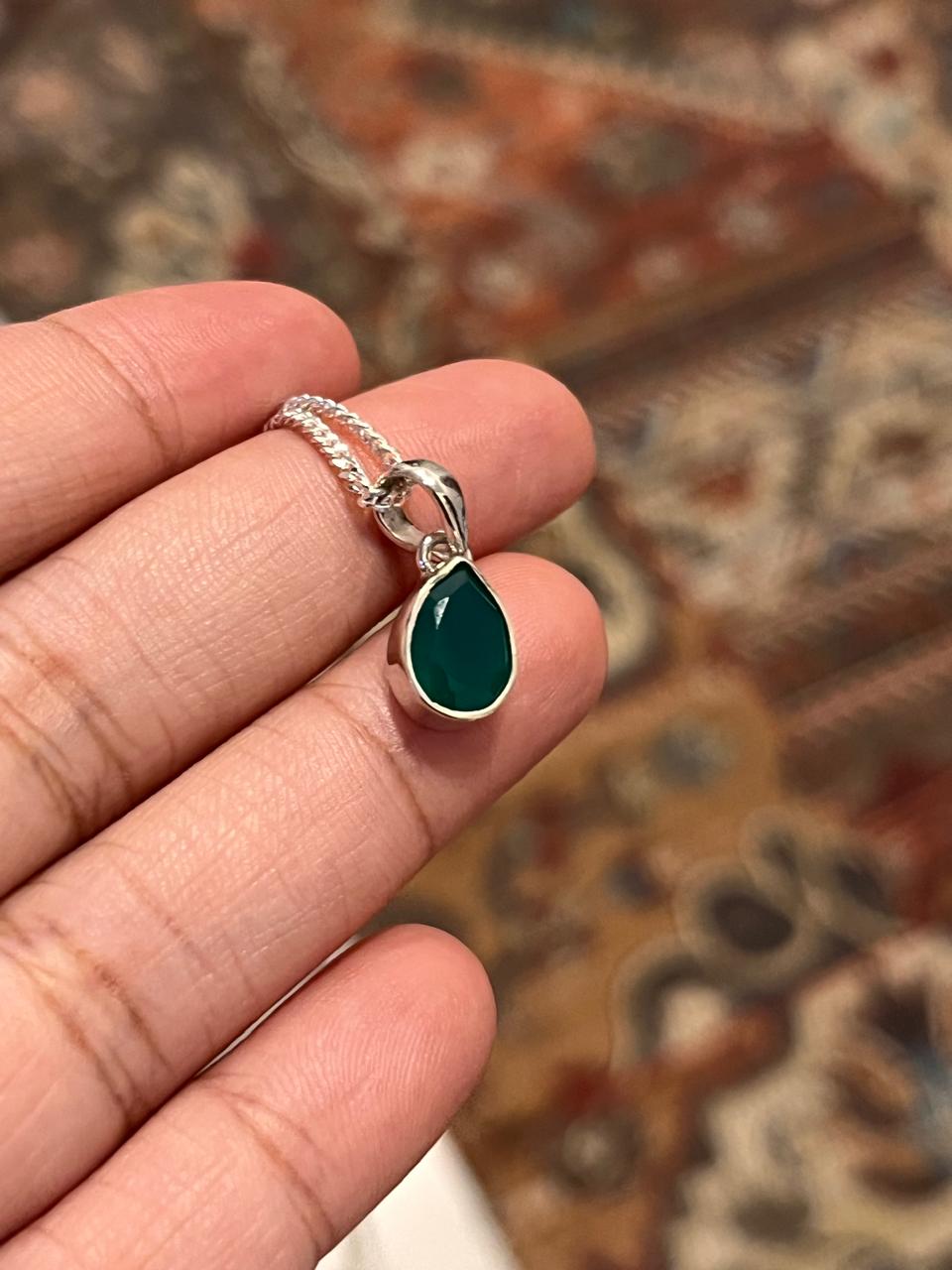 Green onyx pear cut pendant in sterling silver