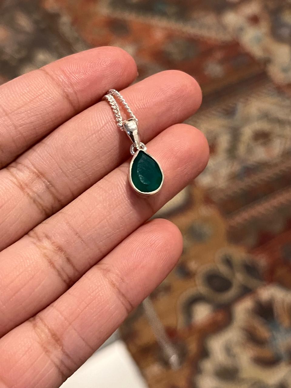 Charming green onyx pear cut pendant with silver setting