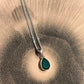 Elegant green onyx pear-shaped pendant set in silver
