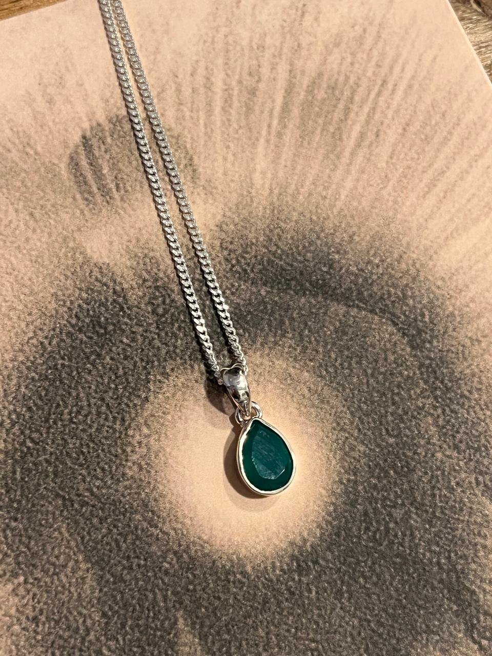 Elegant green onyx pear-shaped pendant set in silver
