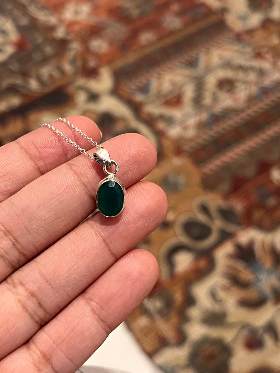 Charming green onyx oval pendant with silver setting