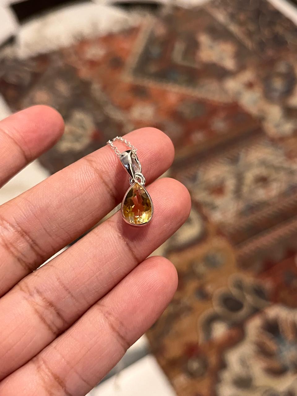 Sleek citrine pear cut pendant in polished sterling silver