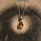 Elegant pear cut citrine stone set in a fine silver pendant