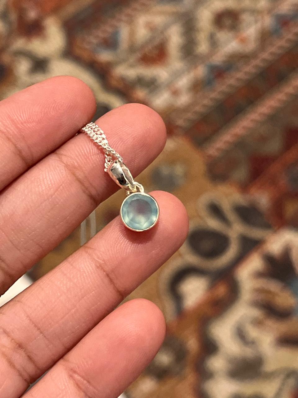 Beautiful round aqua chalcedony silver pendant with polished finish.