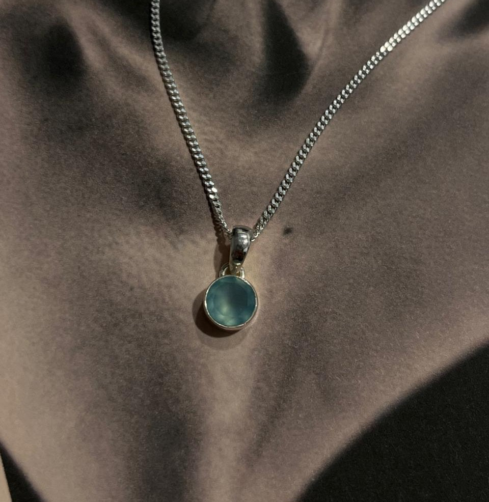 Simple and elegant round aqua chalcedony pendant in fine silver.