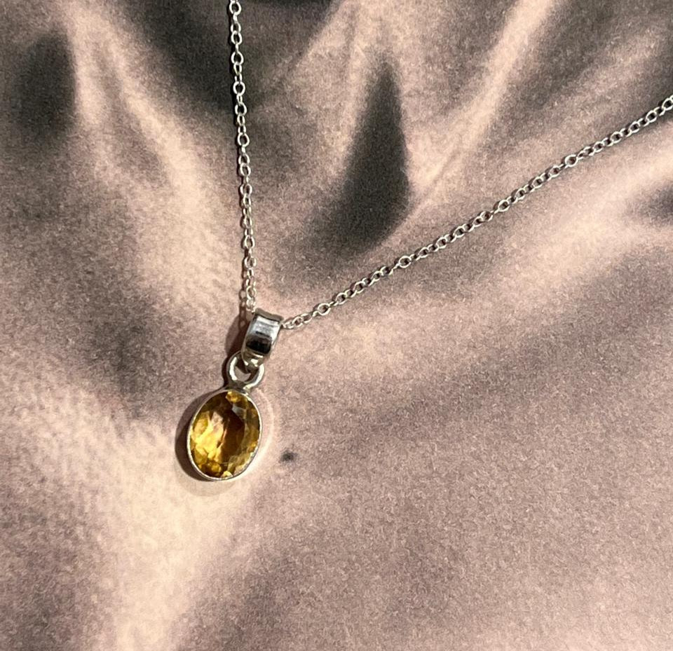 Citrine oval cut silver pendant with elegant design