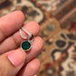 Sterling silver pendant featuring a round cut green onyx stone