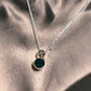 Elegant round cut green onyx pendant set in silver