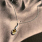 Handcrafted citrine solitaire stone in a cross design, silver pendant