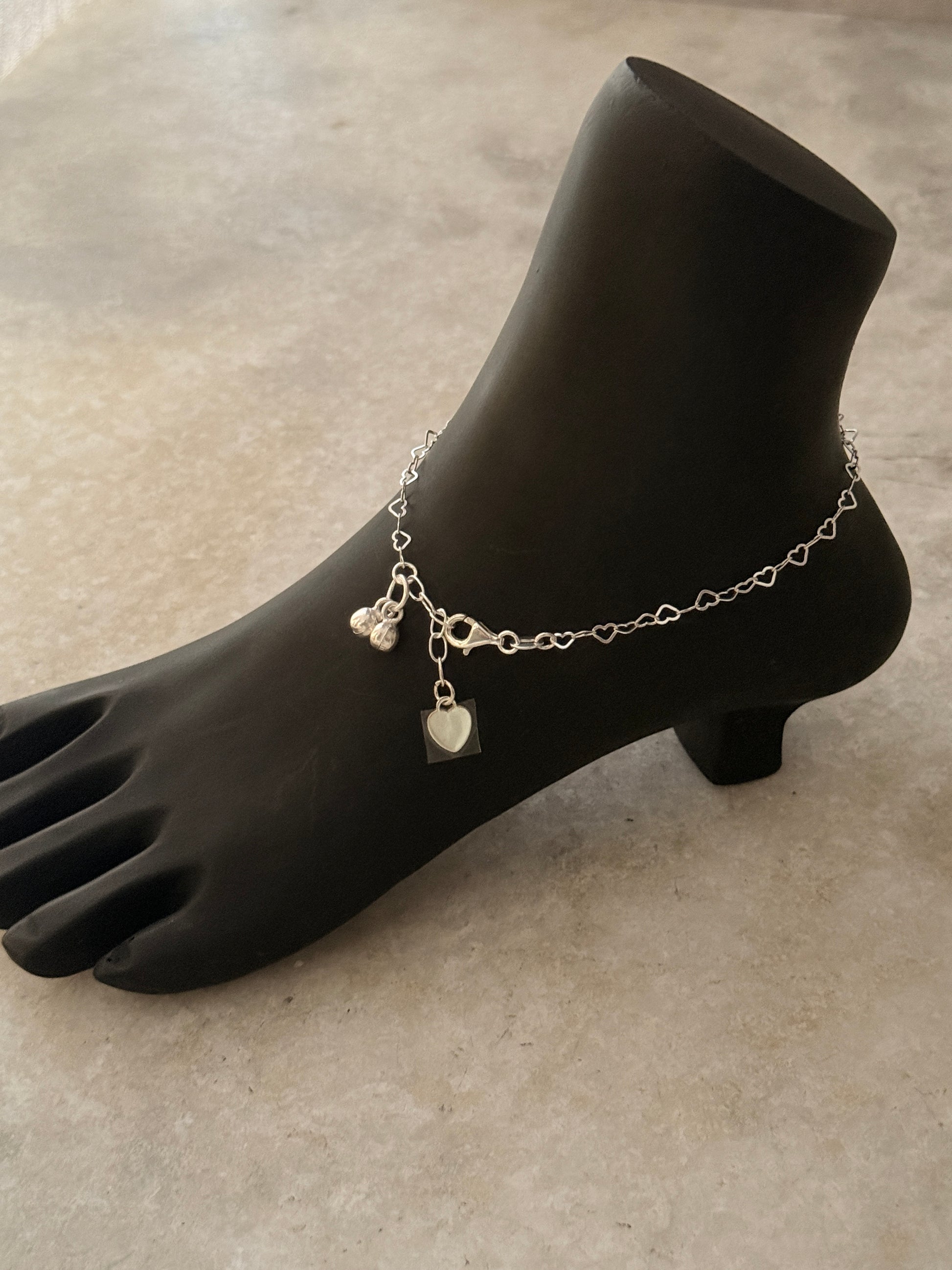 Elegant sterling silver anklet featuring heart chain links  